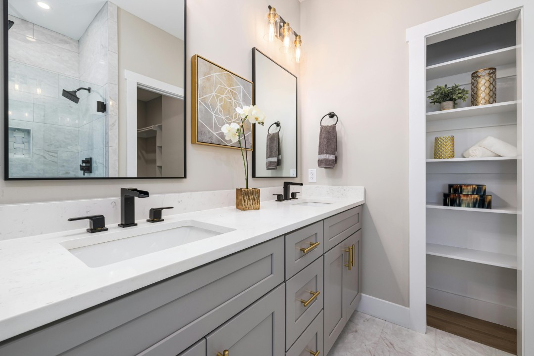 Lindsay Thomas Interiors - Bathroom remodel with gold hardware and open shelving