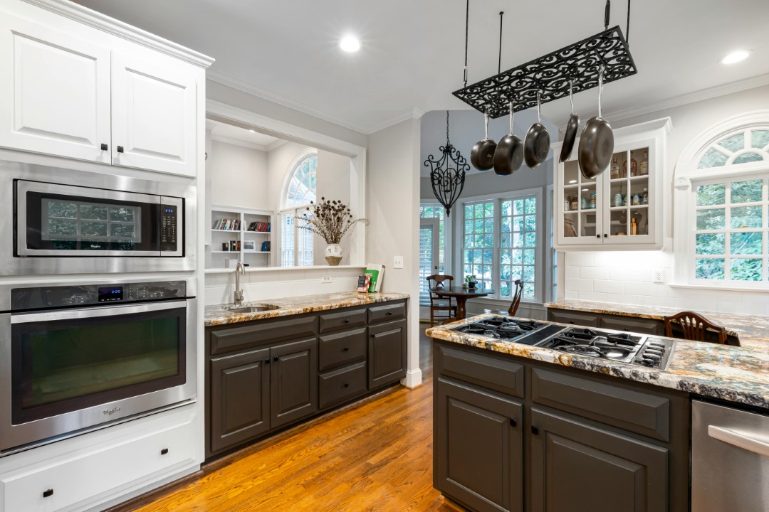 Lindsay Thomas Interiors - Custom kitchen remodel with black cabinets and storage